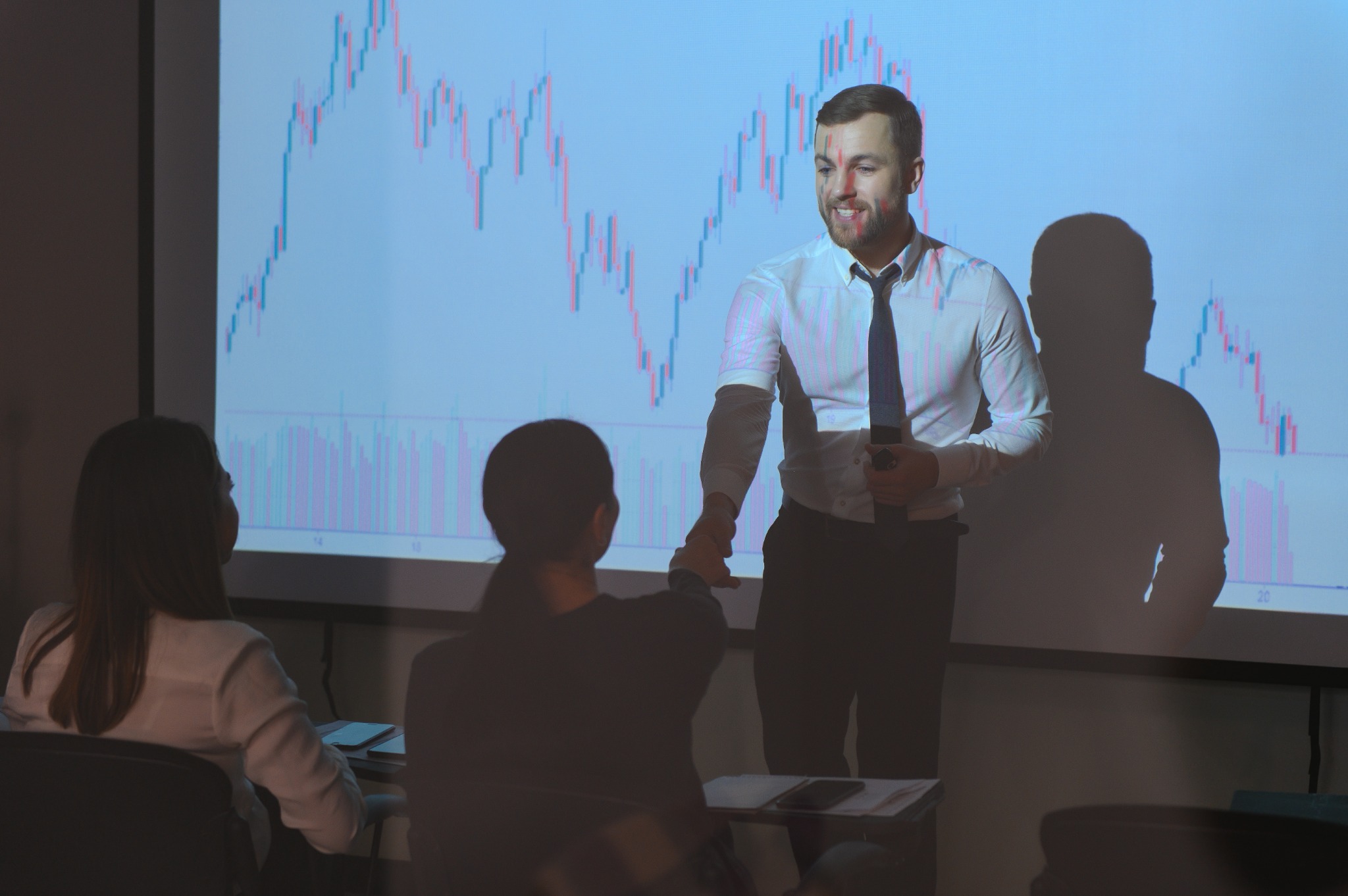Instructor discussing financial data with students